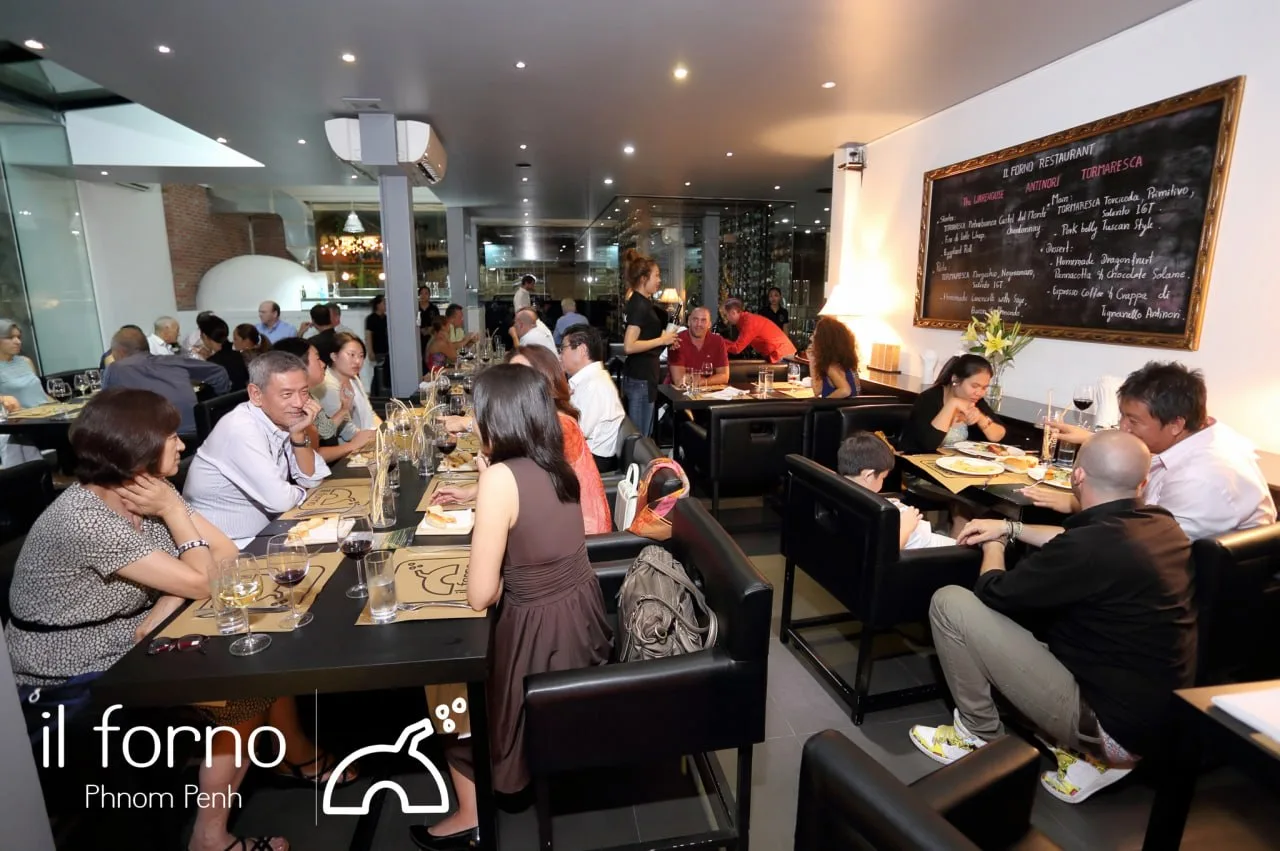 A busy dinner service at Il Forno sees a varied crowd enjoying the evening.