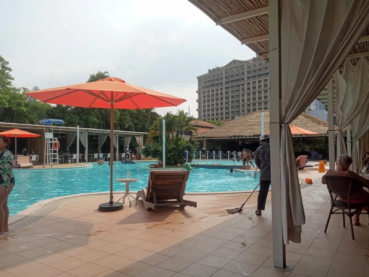 The landscaped pool and shaded cabanas at DIB Club on Diamond Island, the closest Phnom Penh comes to a public beach club
